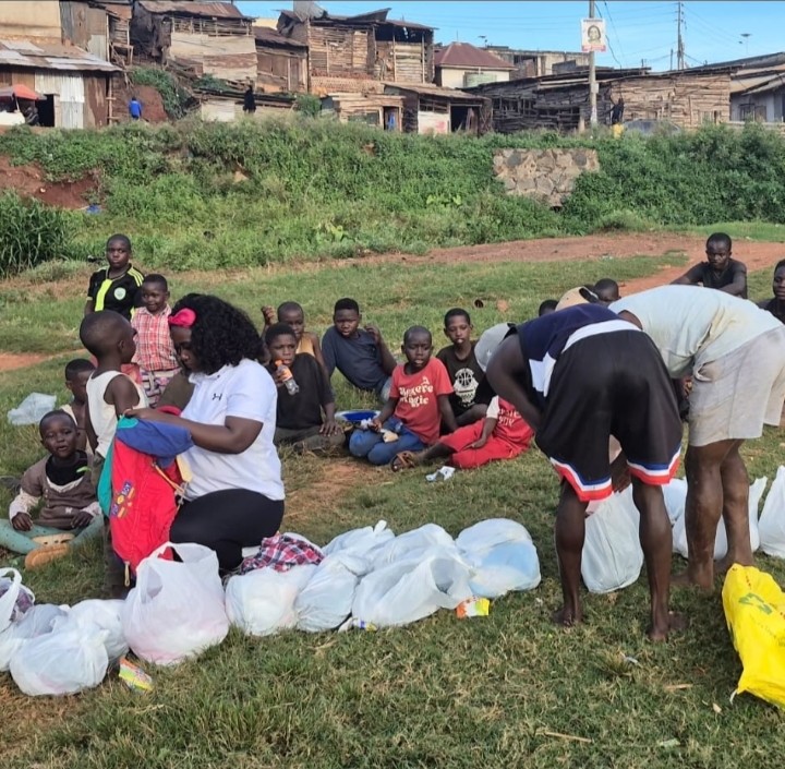 Volunteers distributing essential supplies to children in the community - Delivering Hope, One Bag at a Time